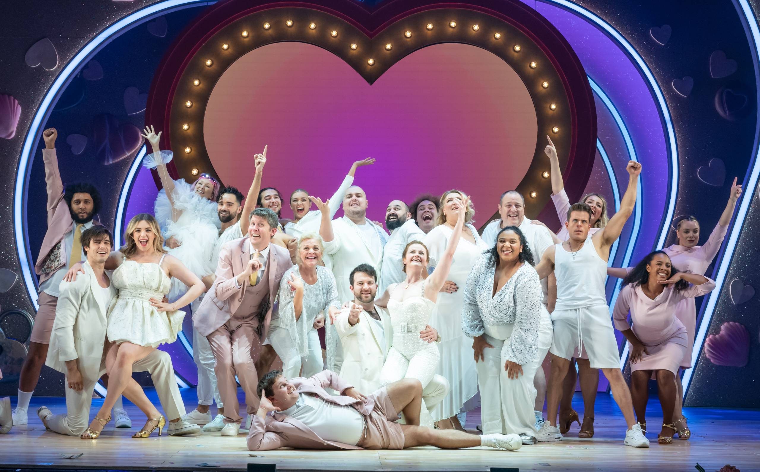 I Should Be So Lucky the entire cast of I Should Be So lucky dressed in white and posing.