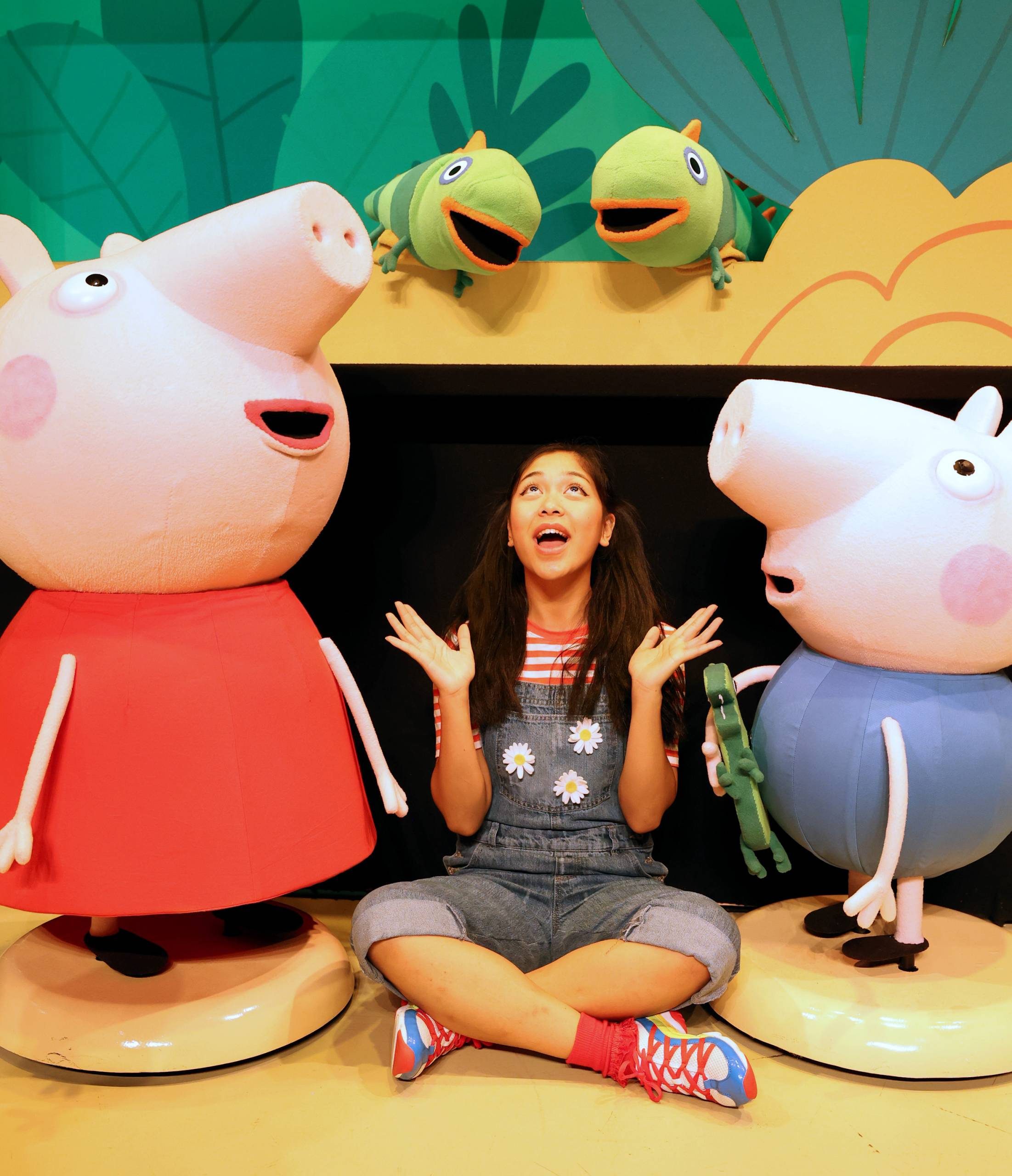 Peppa Pig's Fun Day Out Female character next to Peppa Pig and George.