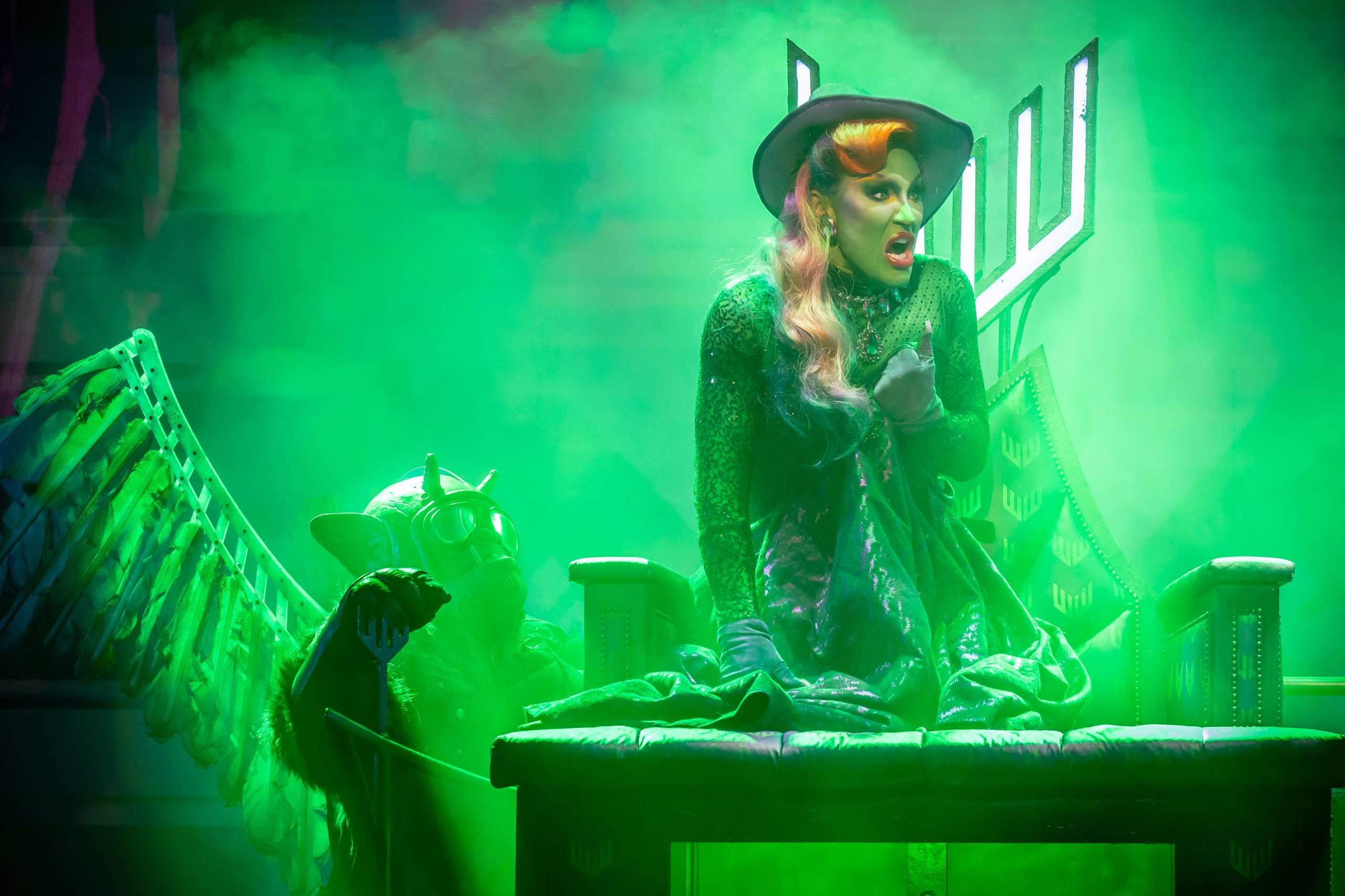 The Wizard Of Oz The wicked witch is melting into a chair whilst one of her monkeys watches.
