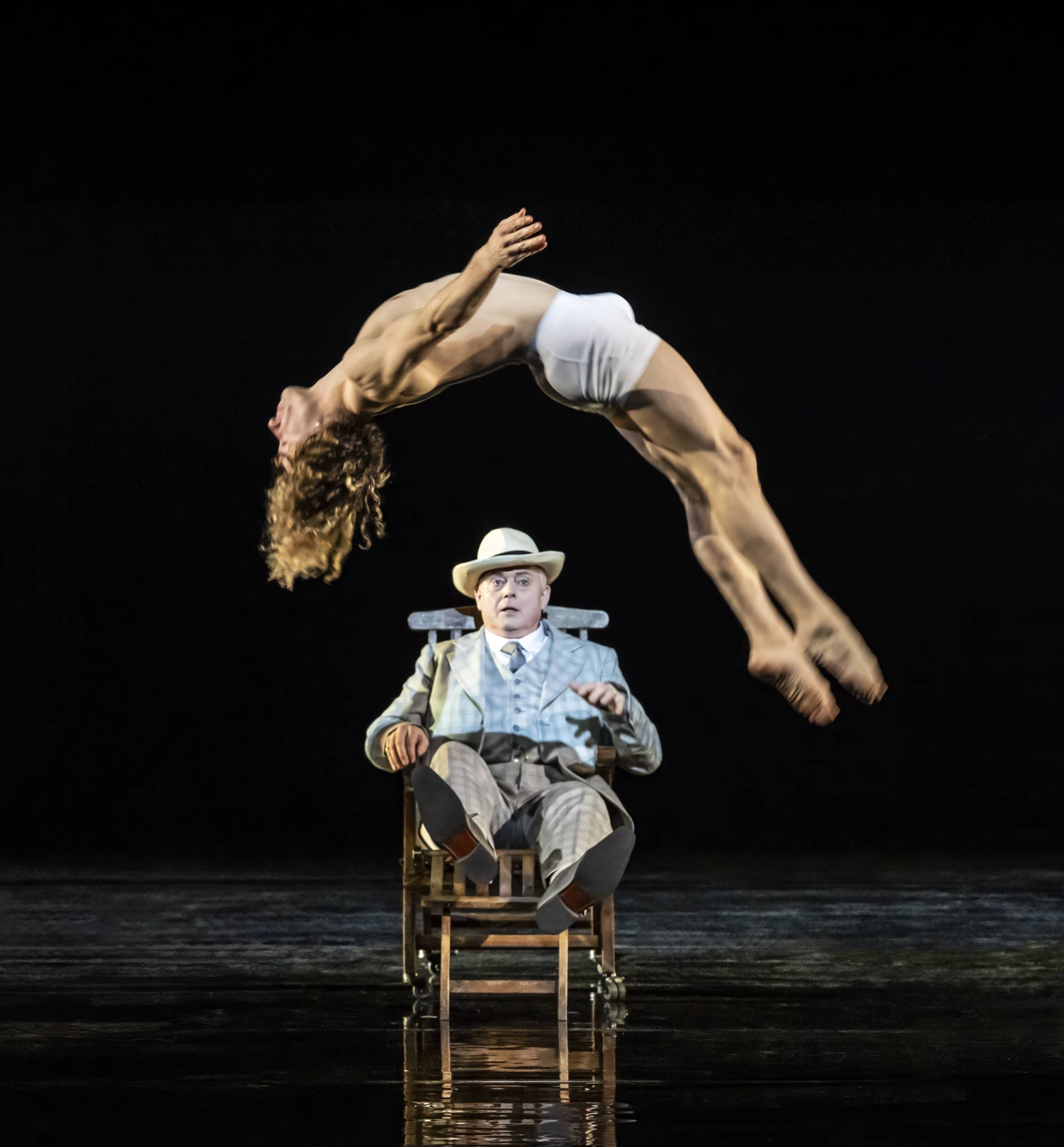 Death in Venice Tadzio Aschebach (Mark le Brocq) watches entranced as Tadzio (Anthony Cesar) does a backwards flip before him.