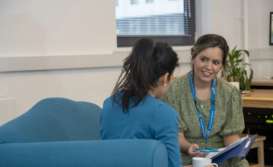 Adviser and student in conversation.
